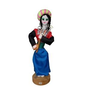 Exquisite Cultural Doll 10 and a half inches tall on wooden base